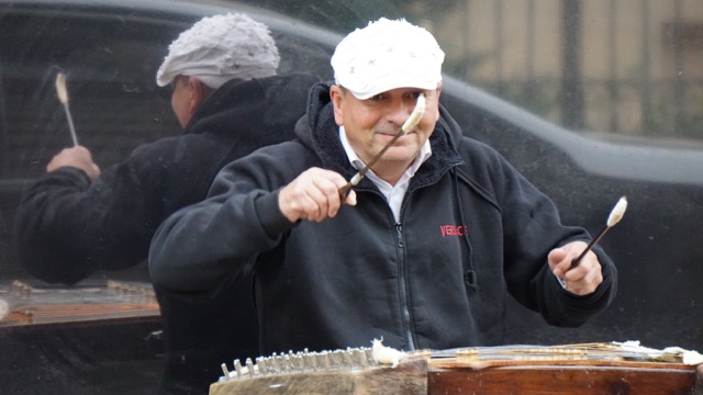 Street musician playing hammer dulcimer, aka cymbalon, aka santur.