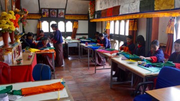 Student embroiderers.