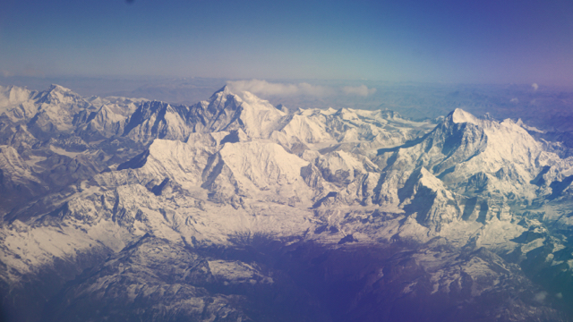 Mt. Everest creates its own weather cloud as seen on the flight into Bhutan.