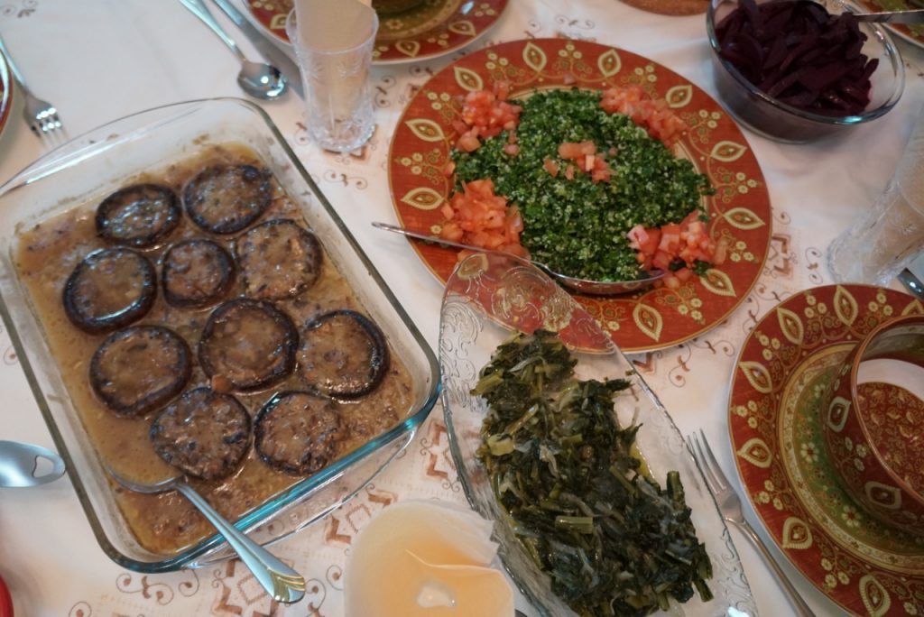 Stuffed mushrooms, tabouli salad, & greens with onions, beets, & beans