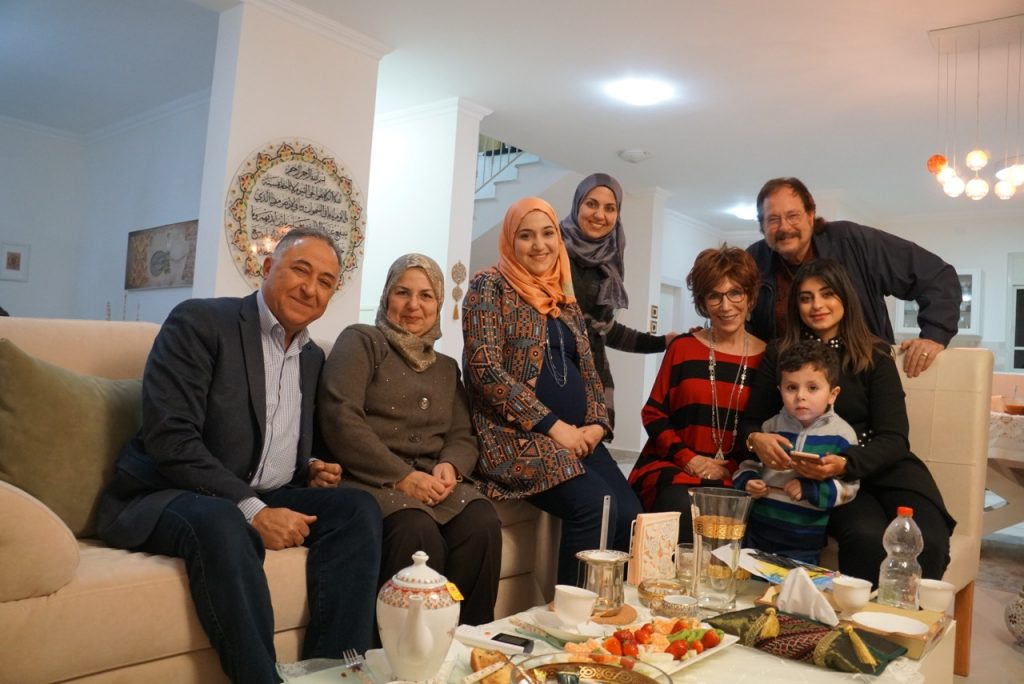 With Aya and her family, including her parents, sisters, and one grandchild