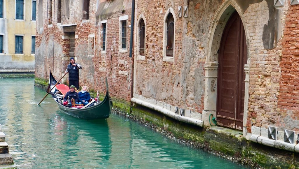 Tourists taking a gondola ride