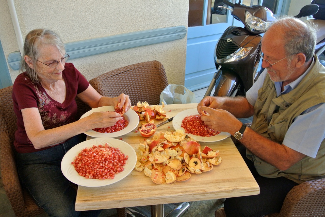 Judy and Dimitrios (my plate was the third one) preparing pomegranate seeds for juicing