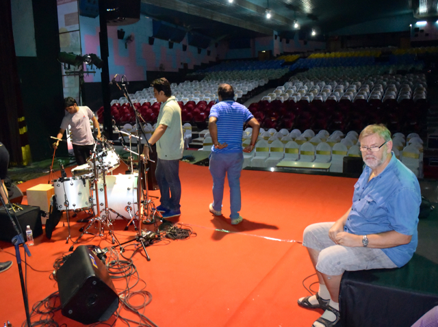 Christian waits patiently as the drums get set up in the Pune concert hall (3000 seats)