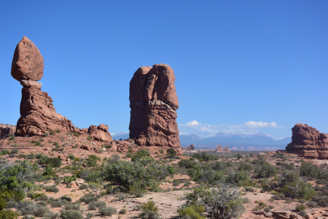 Balance Rock and Arches National Park panorama. Notice the people standing at the right side of Balance Rock.